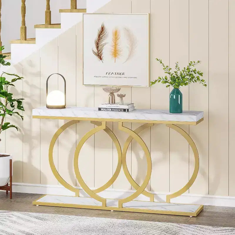 Table console dorée de 140 cm avec plateau en faux marbre et cadre métallique géométrique, capacité de 100 kg
