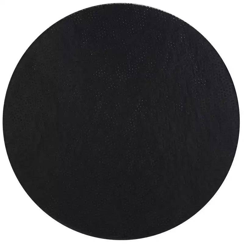 Table basse ronde en aluminium de style marocain avec texture organique, finition noire